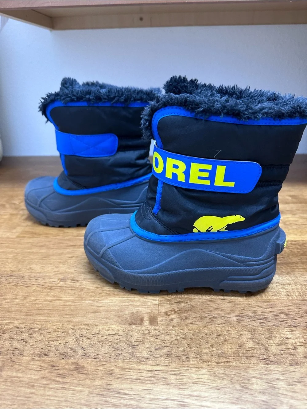 Sorel Kids Black and Blue Winter Boots with Yellow Logo